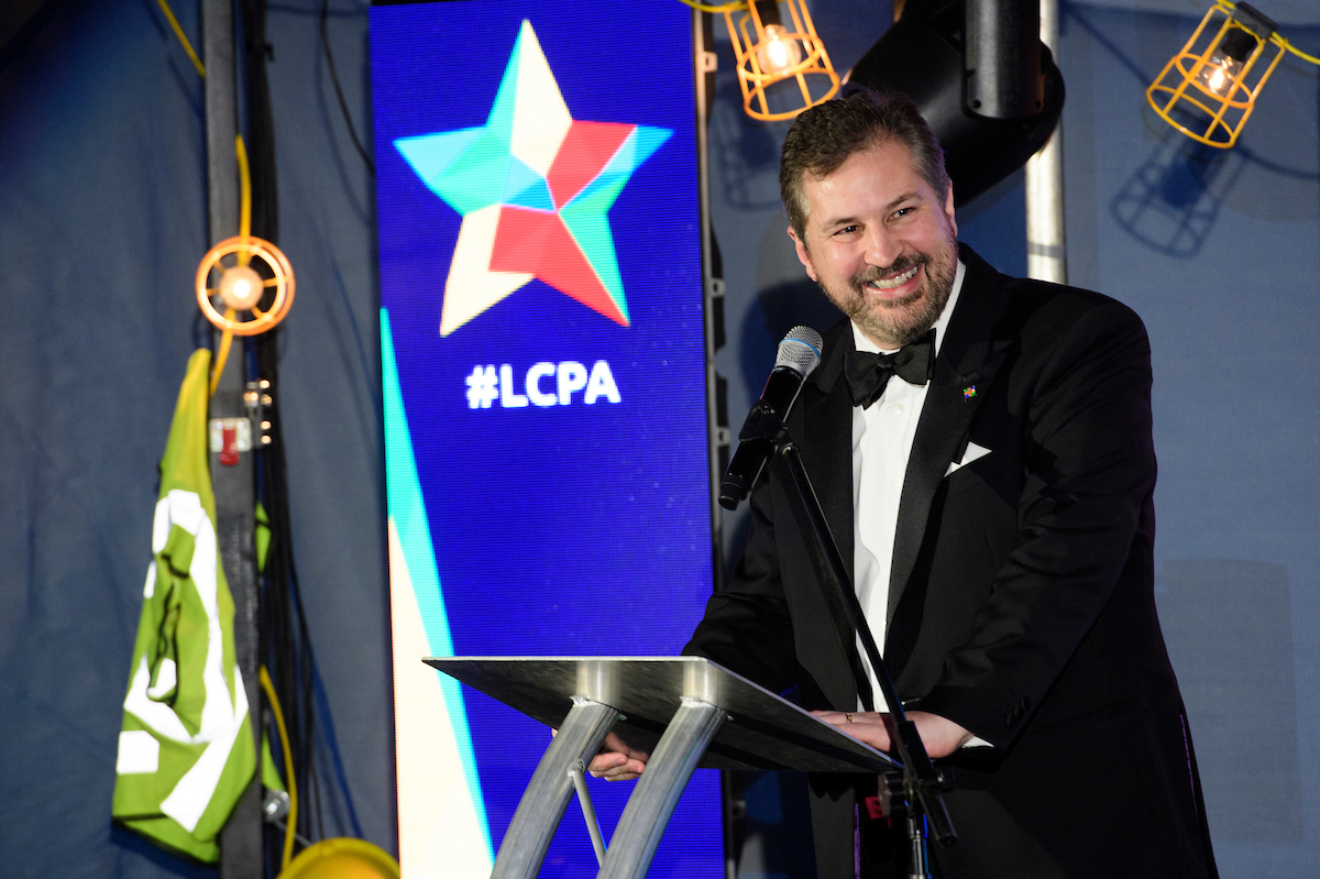 Gary Headland, Chair of the Lincolnshire Chamber of Commerce, wearing formal eveningwear on stage at The Greater Lincolnshire Construction and Property Awards 2020